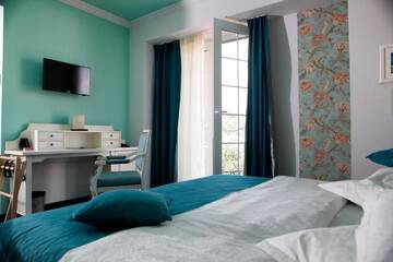 Фото номера Двухместный номер Делюкс с 1 кроватью Отель Simfonia Boutique Hotel г. Рымнику-Вылча 22