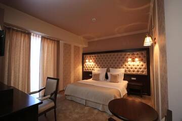 Фото номера Двухместный номер Делюкс с 1 кроватью Отель Simfonia Boutique Hotel г. Рымнику-Вылча 20